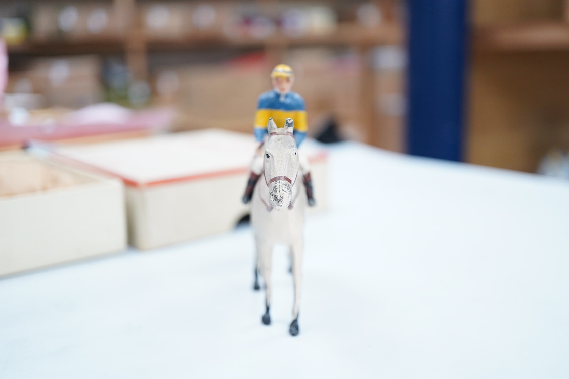 Two boxed Britains Racing Colours of Famous Owners series lead mounted figures; Miss Dorothy Paget - rider in yellow-striped blue jersey on a grey horse, and Msr. M. Boussac - rider in orange jersey on a dark brown horse